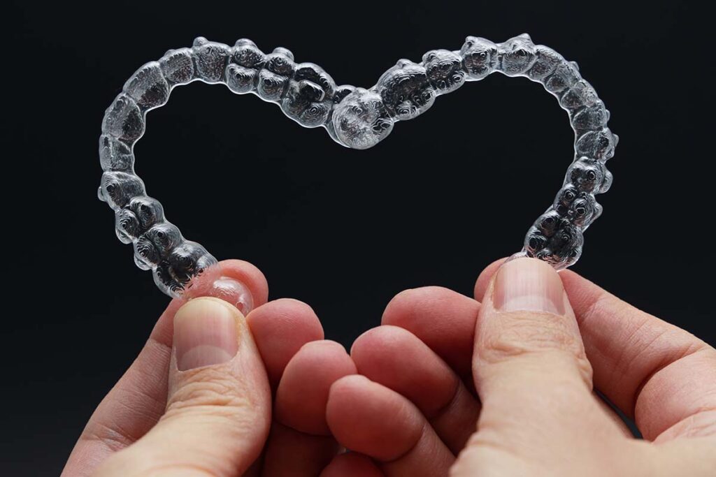 Two aligners held together like a heart can be used for cosmetic dentistry or for functional correction to open the airway